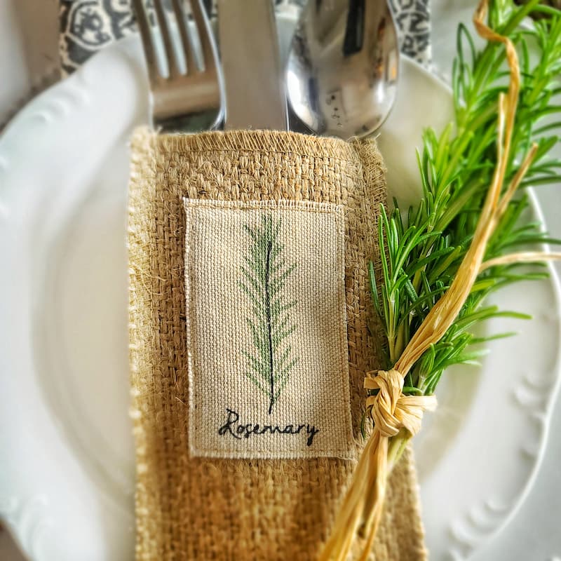 fresh rosemary and silverware pouches with herbs
