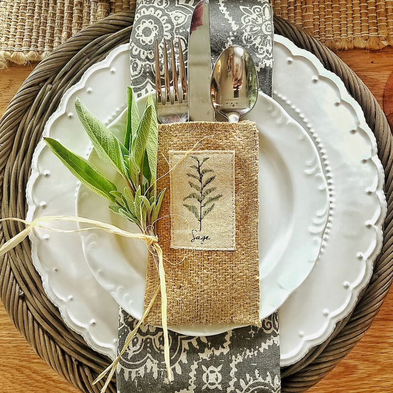 fresh sage and silverware pouches with herbs