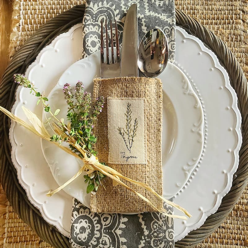 fresh thyme and silverware pouches with herbs