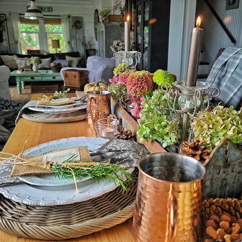 fall flowers, candlelight and herbs create this fall tablescape