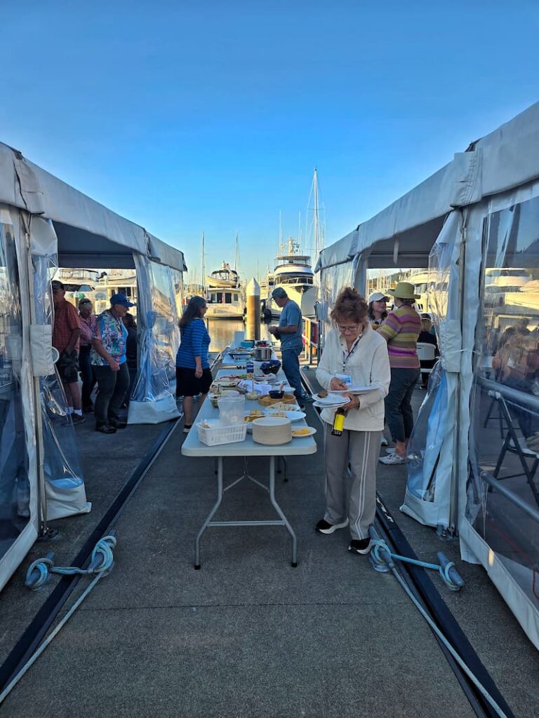 Boaters gathered for a potluck on the marina dock at the Kadey Krogen Rendezvous