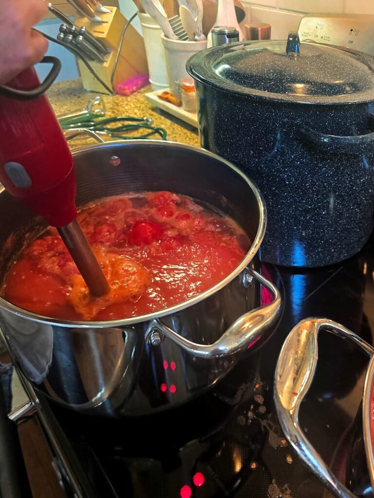Home canning process for garden grown tomatoes at a Pacific Northwest beach cottage