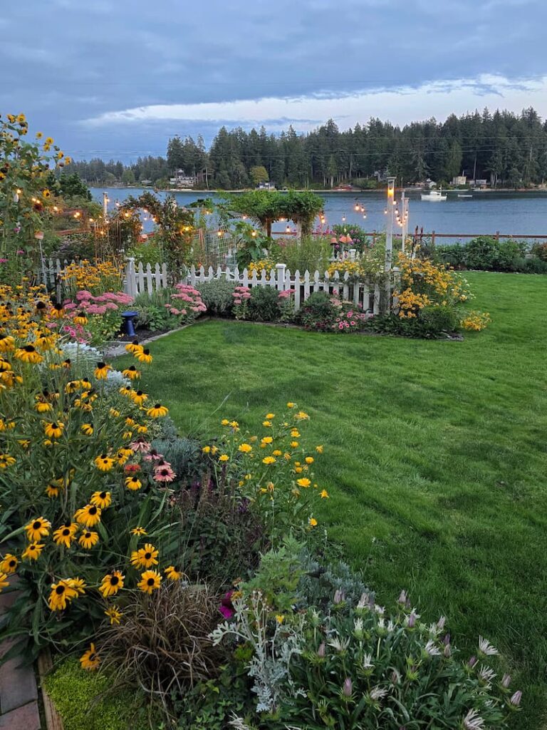 September cottage garden showing seasonal transition at a Pacific Northwest beach cottage