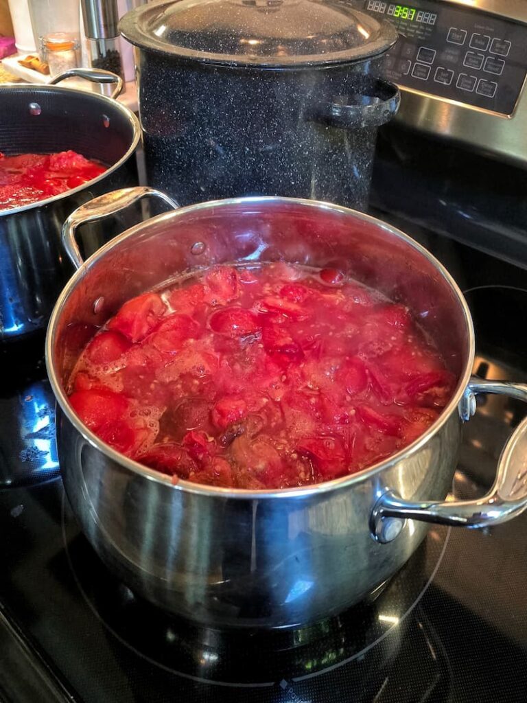 Home canning process for garden grown tomatoes at a Pacific Northwest beach cottage
