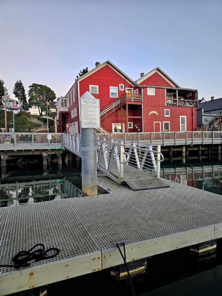 Red waterfront building in La Conner, Washington, seen from the town dock
