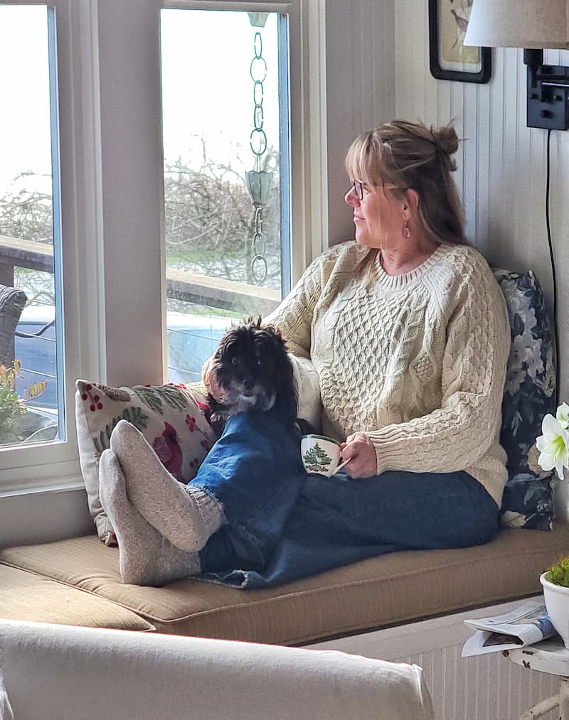 Kim and Jax on the cottage window seat during a Country Home magazine shoot