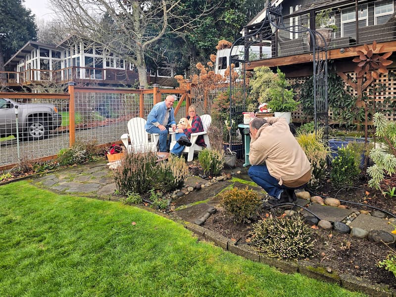 Behind the scenes of a Christmas fire pit photo shoot at a beach cottage