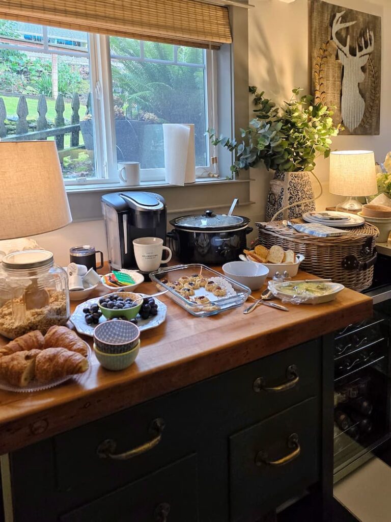 Props and food in a laundry room staging area during a home photo shoot