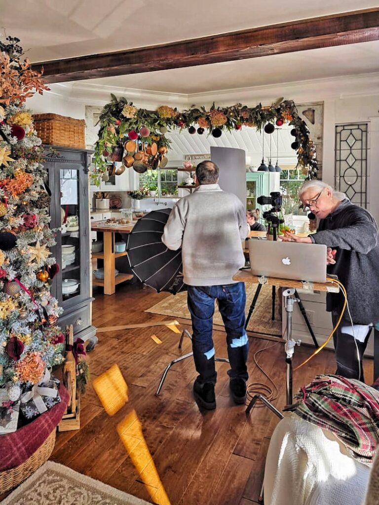 Stylist and photographer setting up a shot inside the cottage during the magazine shoot