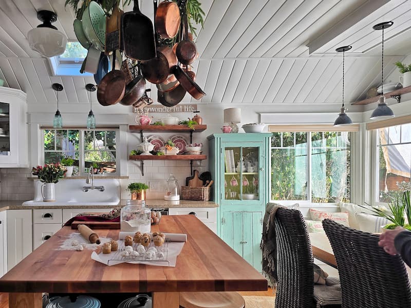 Behind-the-scenes view of a cottage kitchen during a magazine photo shoot
